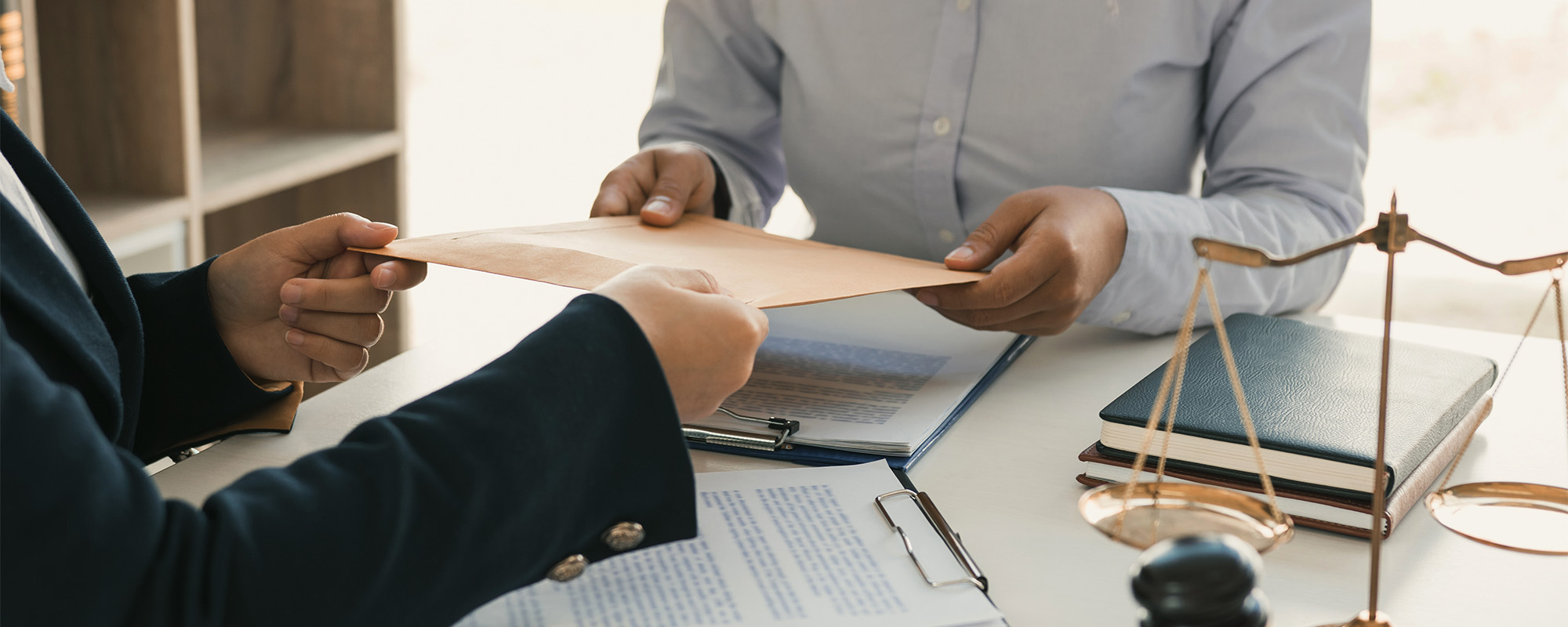 client is submitting information on the paper of the prosecution document to the lawyer.