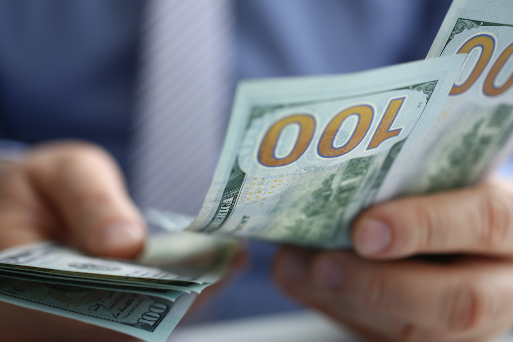 counting hundred bills